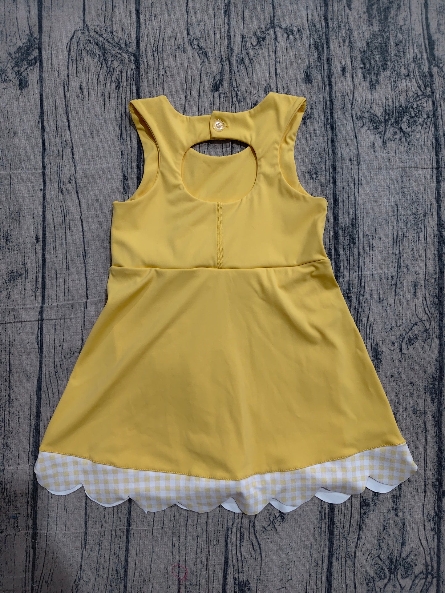 Sleeveless bow yellow scallop girls athletic dress