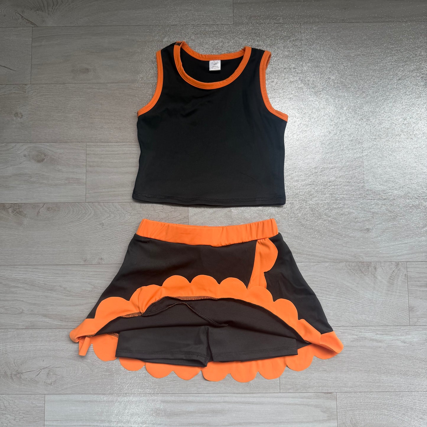 Sleeveless black top orange scallop girls active wear set