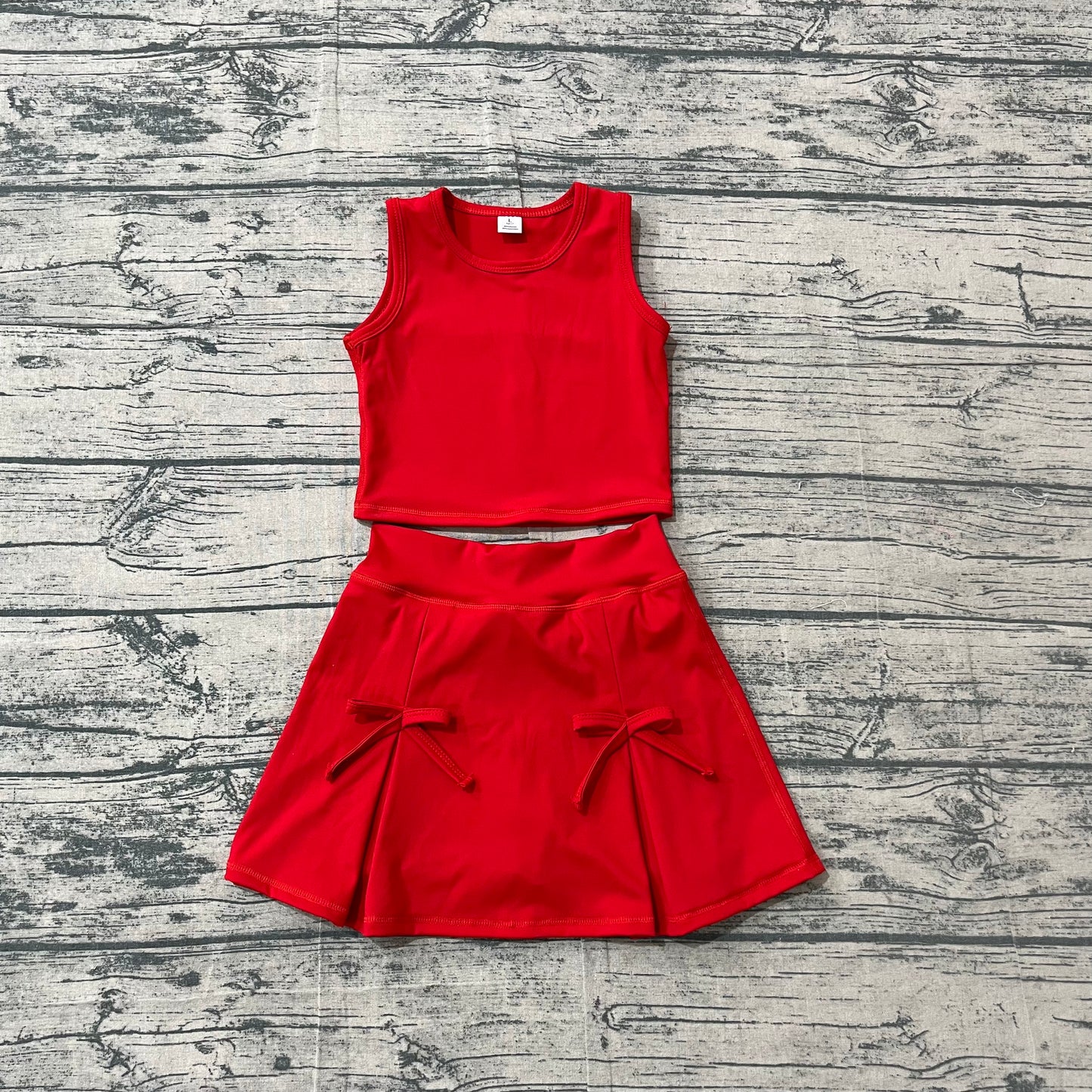 Red sleeveless top bow fold skirt girls active wear set