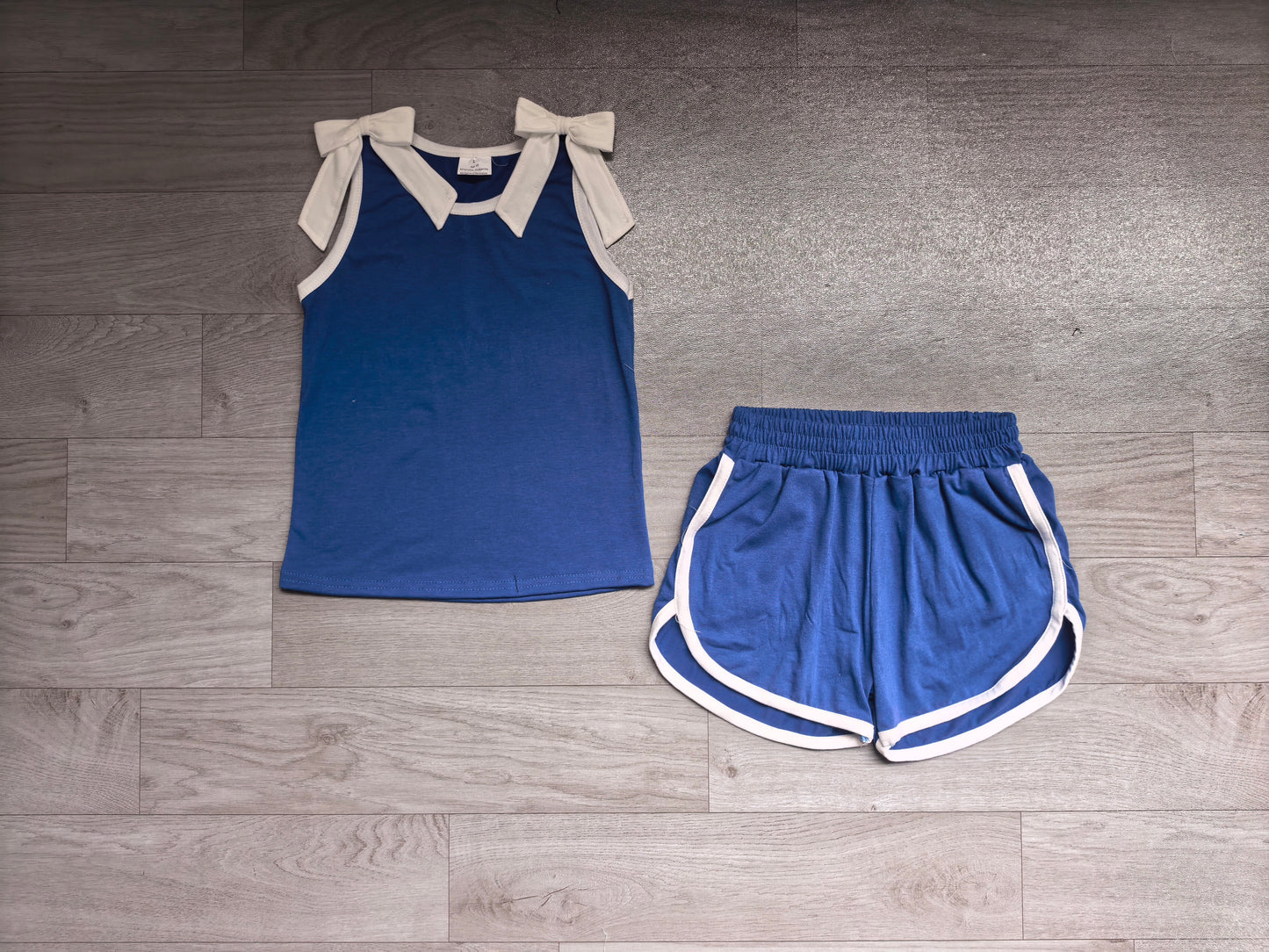 Sleeveless white bow blue top shorts team girls outfits