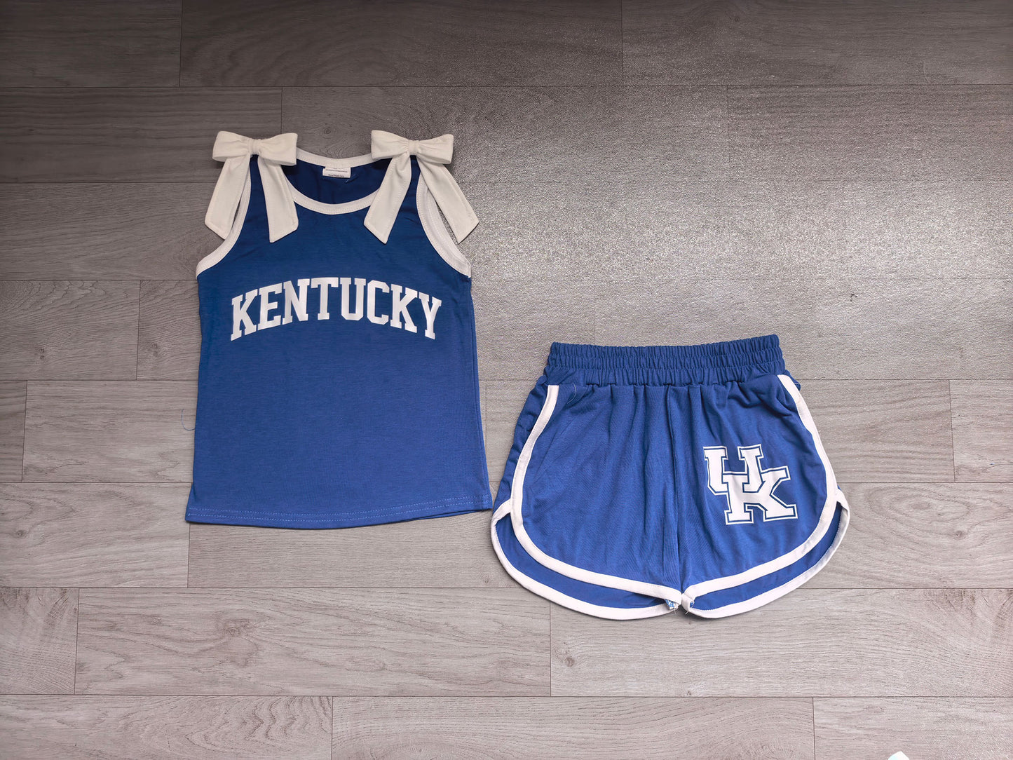 Sleeveless white bow blue top shorts U K team girls outfits