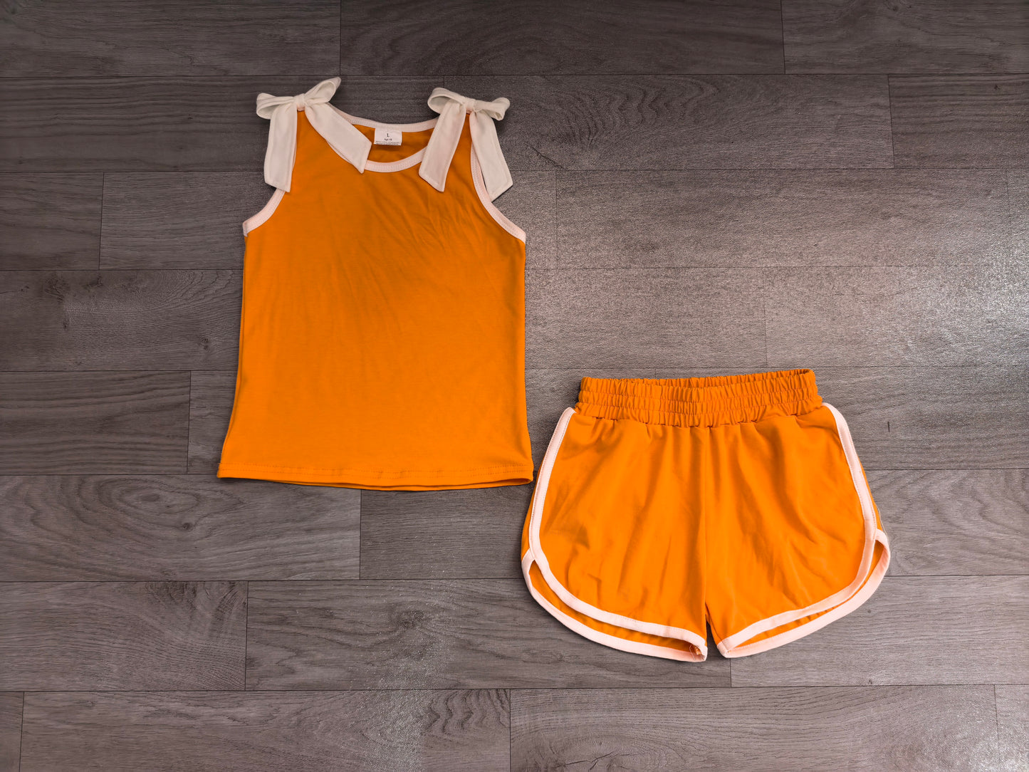 Sleeveless white bow orange top shorts girls team set